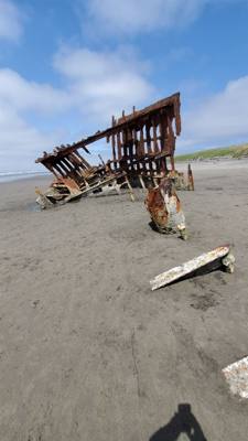 Interesting stop. This beach has a ship under it with parts poking out. Oh yeah, it's like 52 degrees and Oregonians a