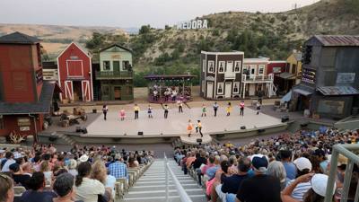 Medora Musical tonight.  Gotta love the backdrop behind all of this.  What a fantastic venue!  Avery is having fun.