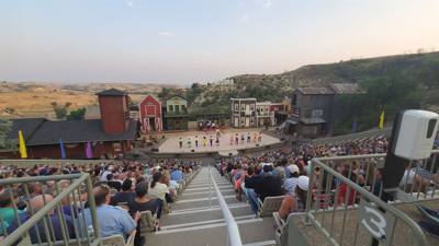 Medora Musical tonight.  Gotta love the backdrop behind all of this.  What a fantastic venue!  Avery is having fun.