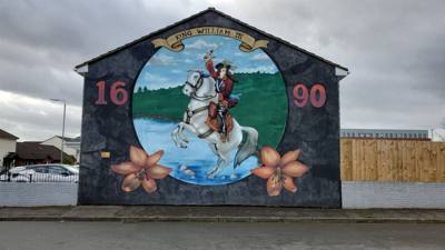 Black Taxi Tours.  If you're not familiar with Irish history there's been a conflict between the Catholics and Protestan