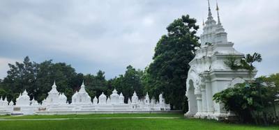 Reliquaries of Northern Thai Royalty.  Tour guide Udom explained the sticks against the tree and other things.  I sugges