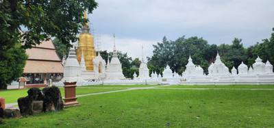 Reliquaries of Northern Thai Royalty.  Tour guide Udom explained the sticks against the tree and other things.  I sugges