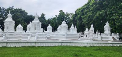 Reliquaries of Northern Thai Royalty. Tour guide Udom explained the sticks against the tree and other things. I sugges