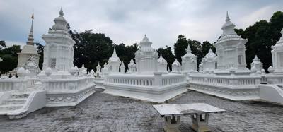 Reliquaries of Northern Thai Royalty. Tour guide Udom explained the sticks against the tree and other things. I sugges
