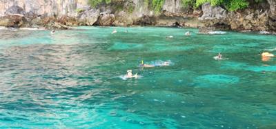 First, second and third stops today were on Phi Phi Lay Island.  Swimming, monkeys and snorkeling.  The swim cove was be