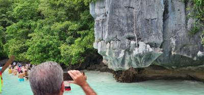 First, second and third stops today were on Phi Phi Lay Island. Swimming, monkeys and snorkeling. The swim cove was be