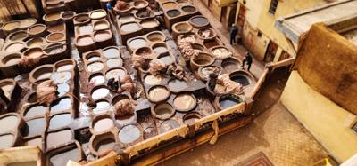 The visit to the leather area of the Fes Medina market was interesting. They cure and dye the leather in these big pots