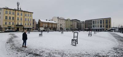 64 chairs.  One for each 1000 of the 64,000 residents of the Jewish ghetto in Krakow, Poland.