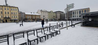 64 chairs.  One for each 1000 of the 64,000 residents of the Jewish ghetto in Krakow, Poland.